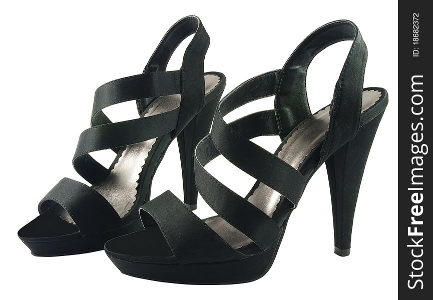 Elegant black female shoes over white surface. Elegant black female shoes over white surface