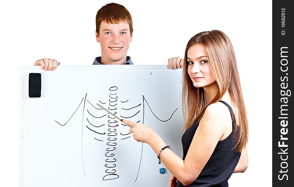 Girl points to white board. Girl points to white board