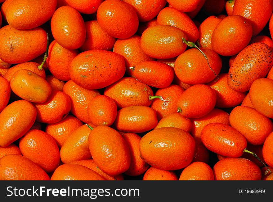 Kumquats in a fruit market. Kumquats in a fruit market