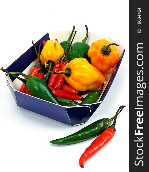A selection of mixed chillies in a cardboard tray