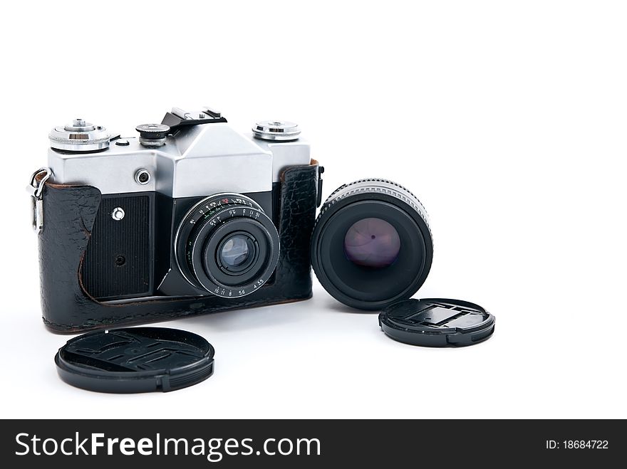 Retro-styled camera and lens isolated on white