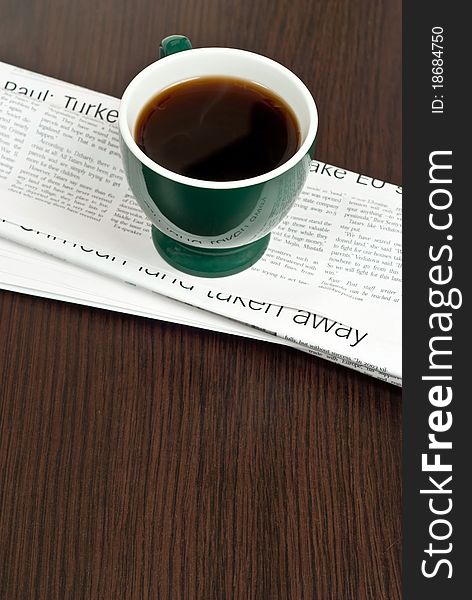 Cup Of Coffee On Newspaper