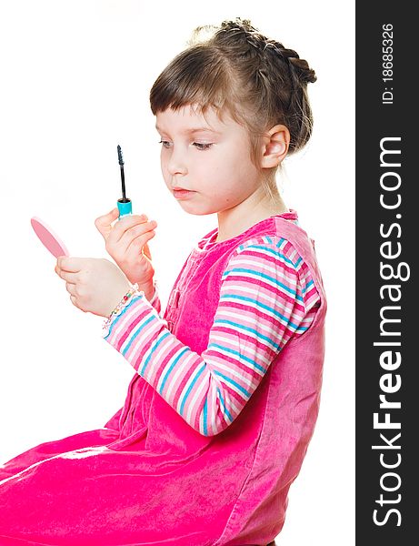 Young girl applies mascara. Isolated on a white background. Young girl applies mascara. Isolated on a white background.