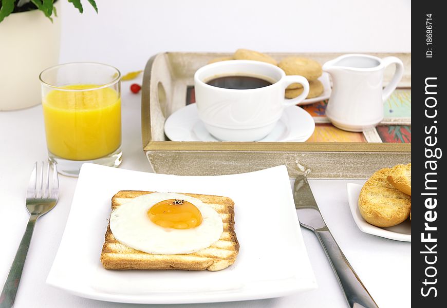 Breakfast set with fried egg on toast