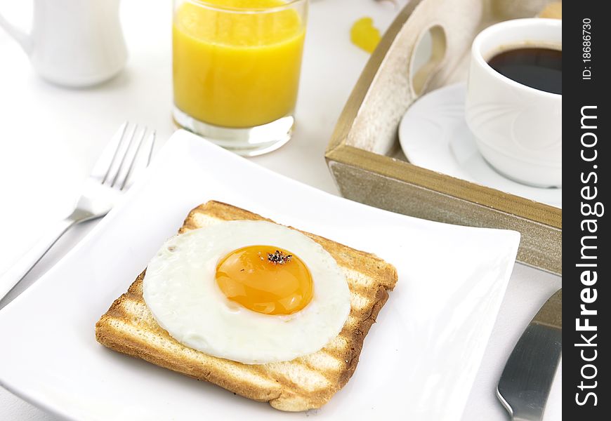 Breakfast set with fried egg on toast