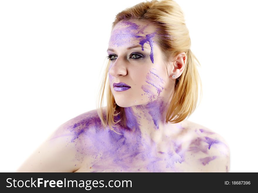 Concept studio portrait of a young woman smeared in purple ink isolated on white. Concept studio portrait of a young woman smeared in purple ink isolated on white