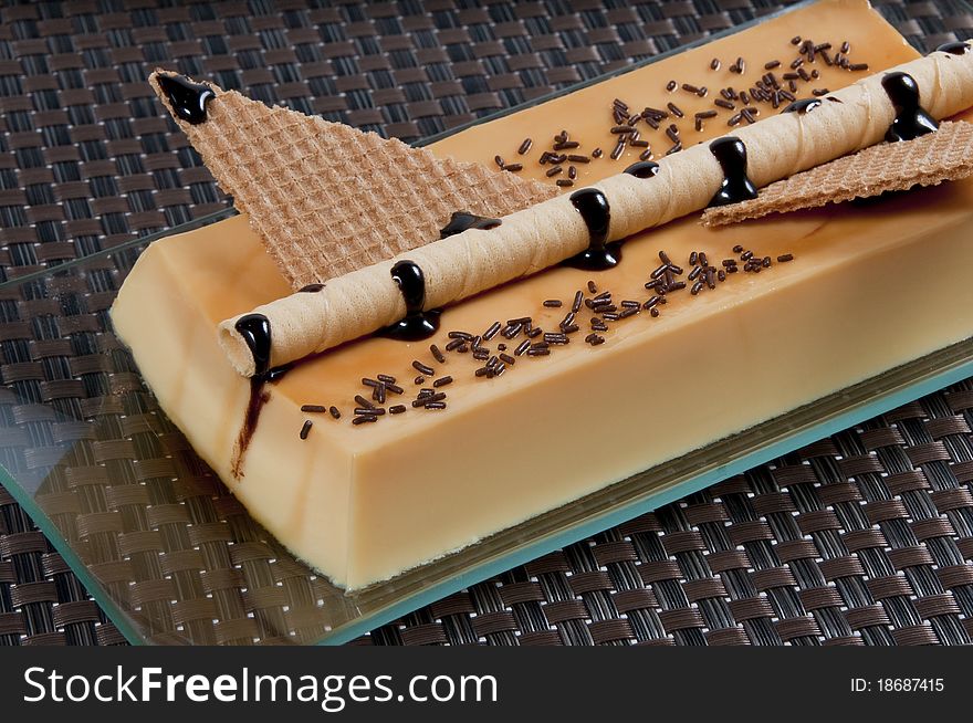 Custard picture with rolled wafers and chocolate. Custard picture with rolled wafers and chocolate