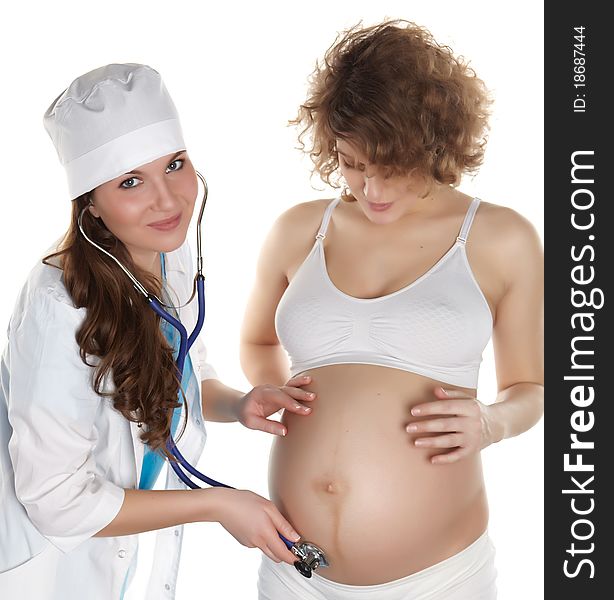 Studio photography of a doctor checks the abdomen and heardbeat of pregnant women isolated on white backgroud. Studio photography of a doctor checks the abdomen and heardbeat of pregnant women isolated on white backgroud