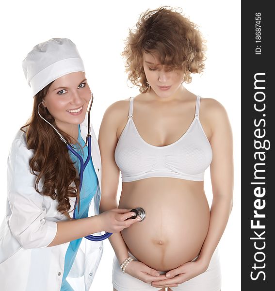 Studio photography of a doctor checks the abdomen and heardbeat of pregnant women isolated on white backgroud. Studio photography of a doctor checks the abdomen and heardbeat of pregnant women isolated on white backgroud