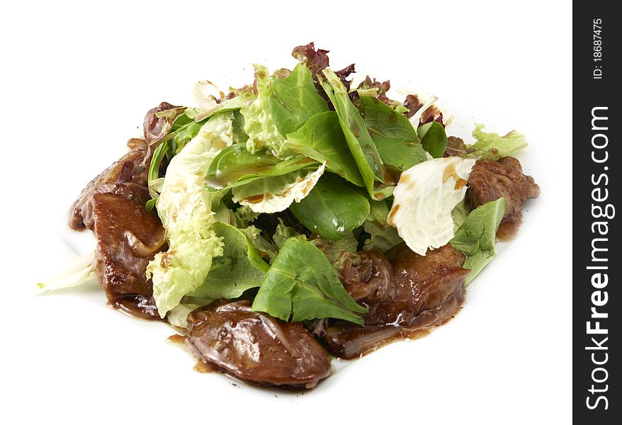 Studio photography of a salad with meat on white background