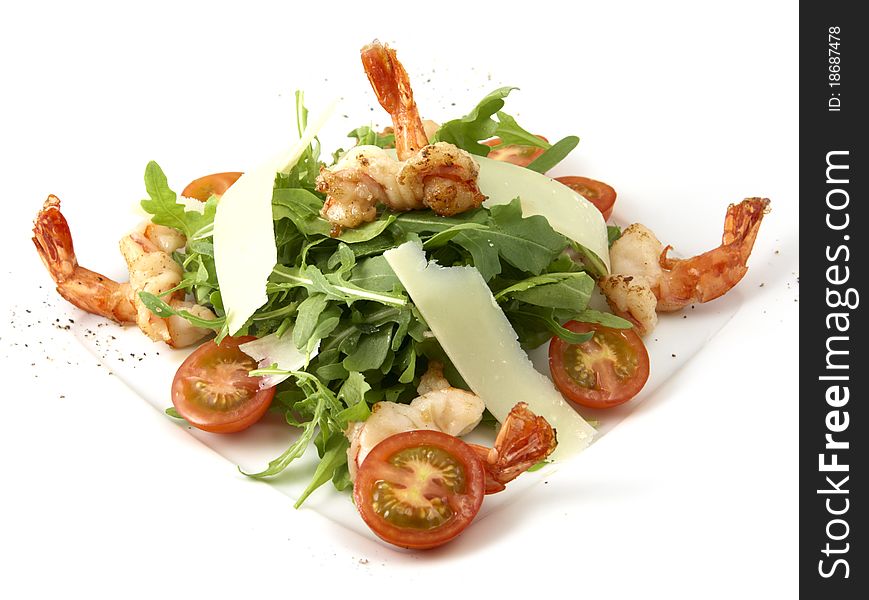 Studio photography of a Caesar salad with prawns and cheese on white background