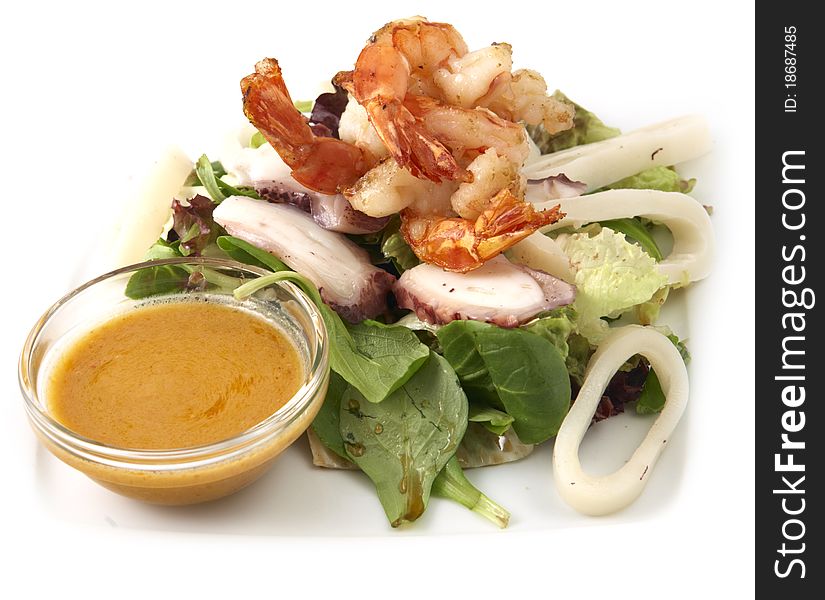 Studio photography of a seafood salad with prawns and calamary on white background