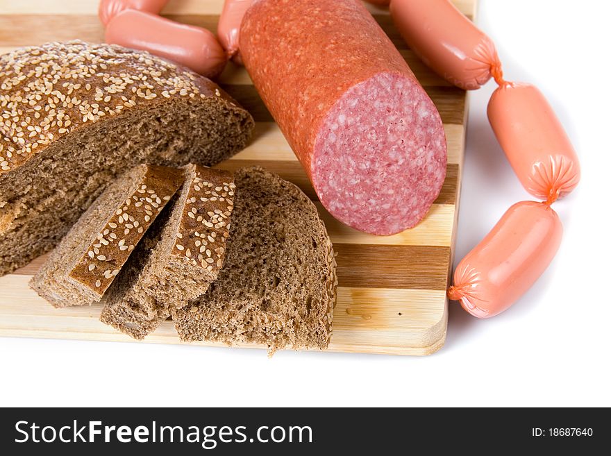 Bread and sausages on a white background