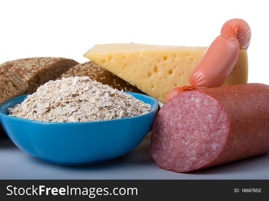 Bread,  cheese and sausage on a white background