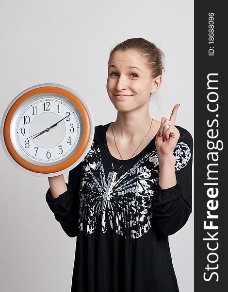 Beautiful Girl With A Big Clock In His Hands