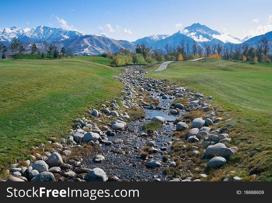 Golf meadow landscape. Almaty city.