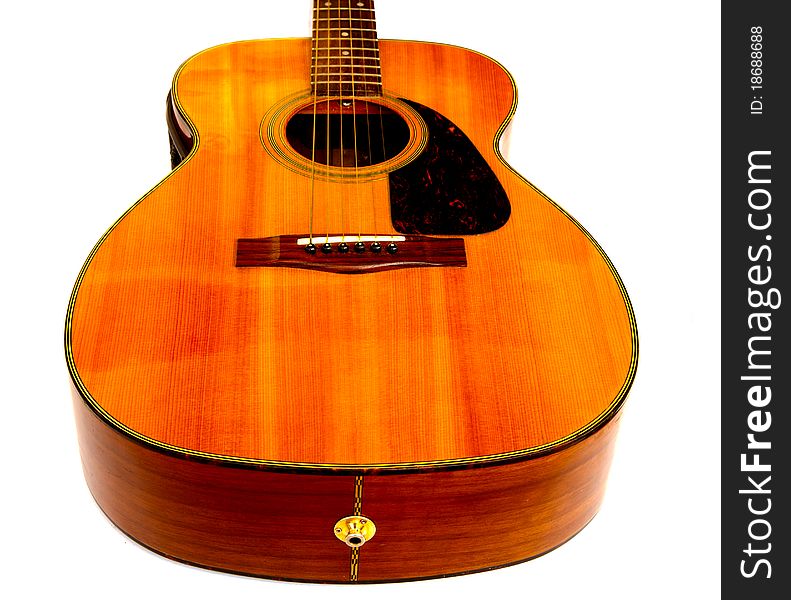 Solid body electric/acoustic guitar with spruce top and maple side and back isolated on white.