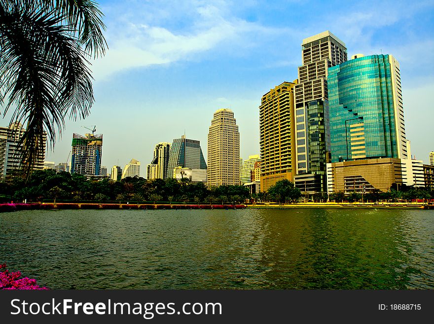 Cityscape of many buildings and reflection in lake. Cityscape of many buildings and reflection in lake