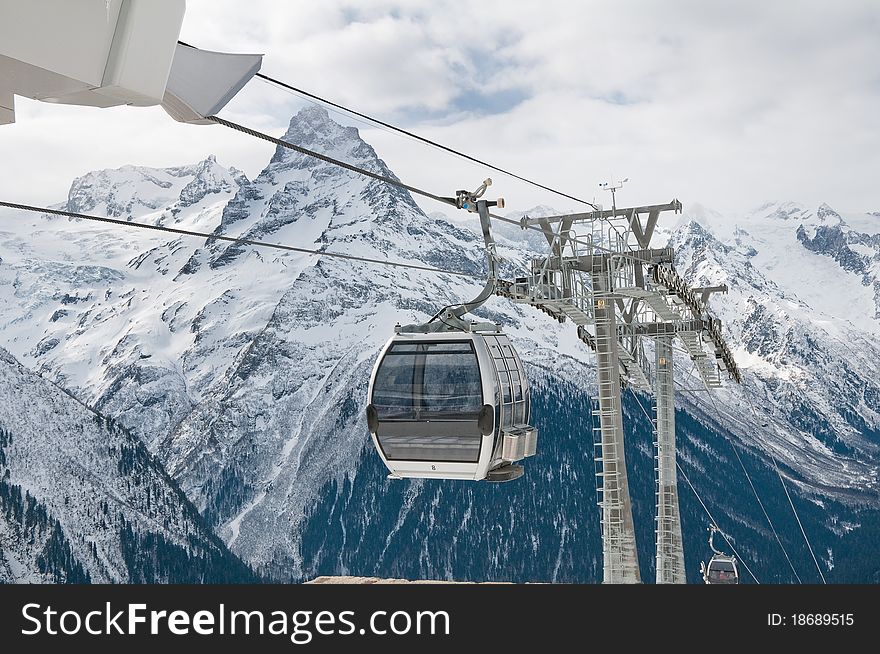 Rope-way on a mounting skiing resort in Russia. Settlement Dombai.The Caucasian mountains. Rope-way on a mounting skiing resort in Russia. Settlement Dombai.The Caucasian mountains.