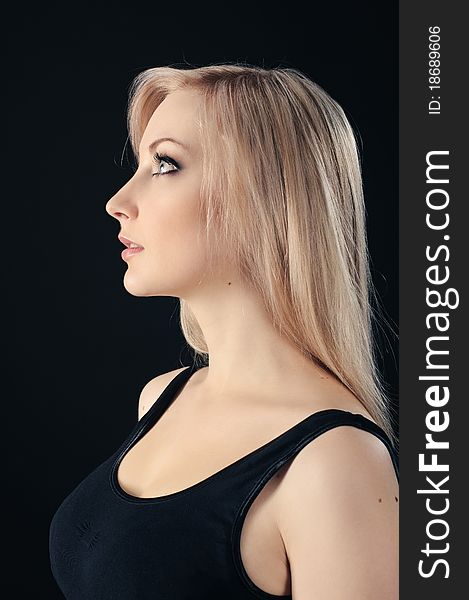 Portrait of beauty blonde girl on black background. Portrait of beauty blonde girl on black background