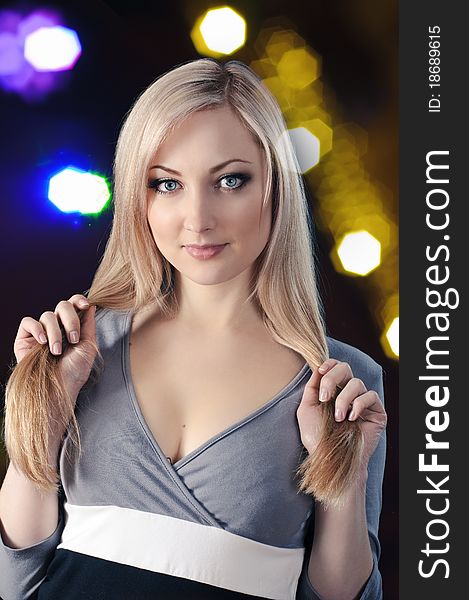 Portrait of beauty blonde girl on black background with night lights. Portrait of beauty blonde girl on black background with night lights