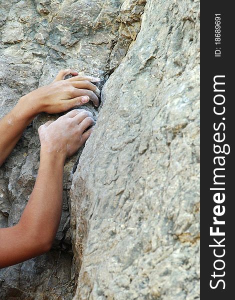 Climbers hands on the rock