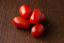 Group Of Red Cherry Tomatoes On Wood Table Royalty Free Stock Image