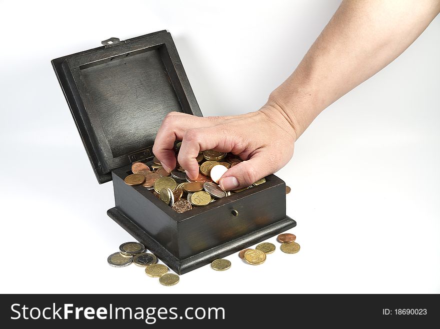 A man stealing coins from a box