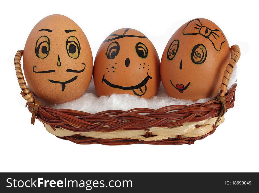 Eggs in a basket with painted faces