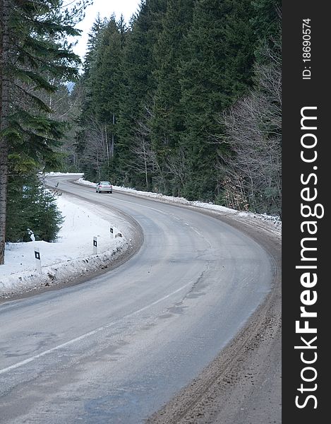 Difficult conditions of mountain road during a snowfall. Difficult conditions of mountain road during a snowfall.