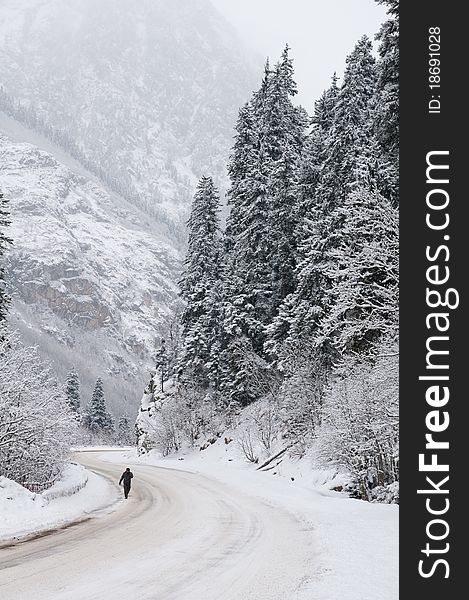 Difficult conditions of mountain road during a snowfall. Difficult conditions of mountain road during a snowfall.