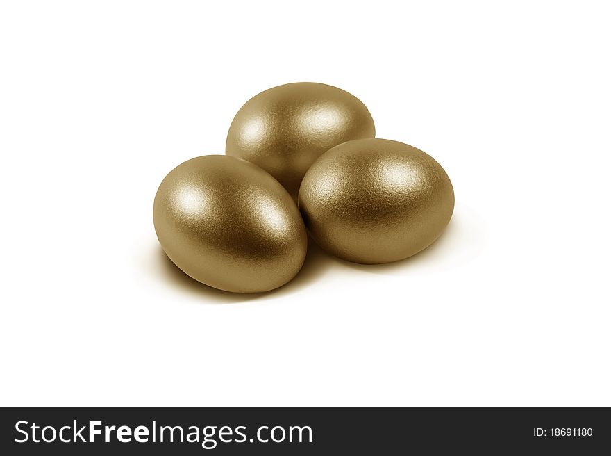 3 golden eggs on white background