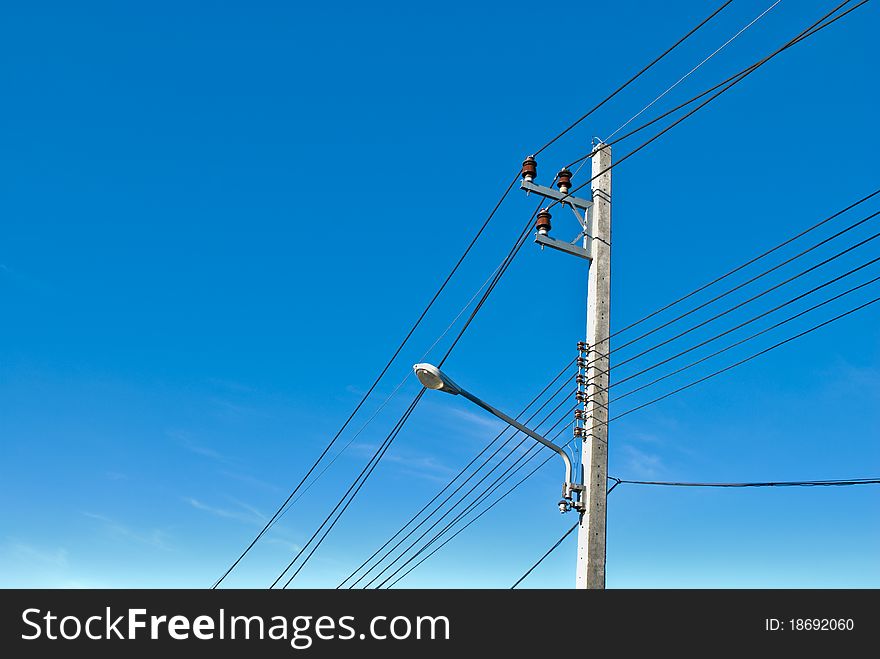 Electricity post with blue sky