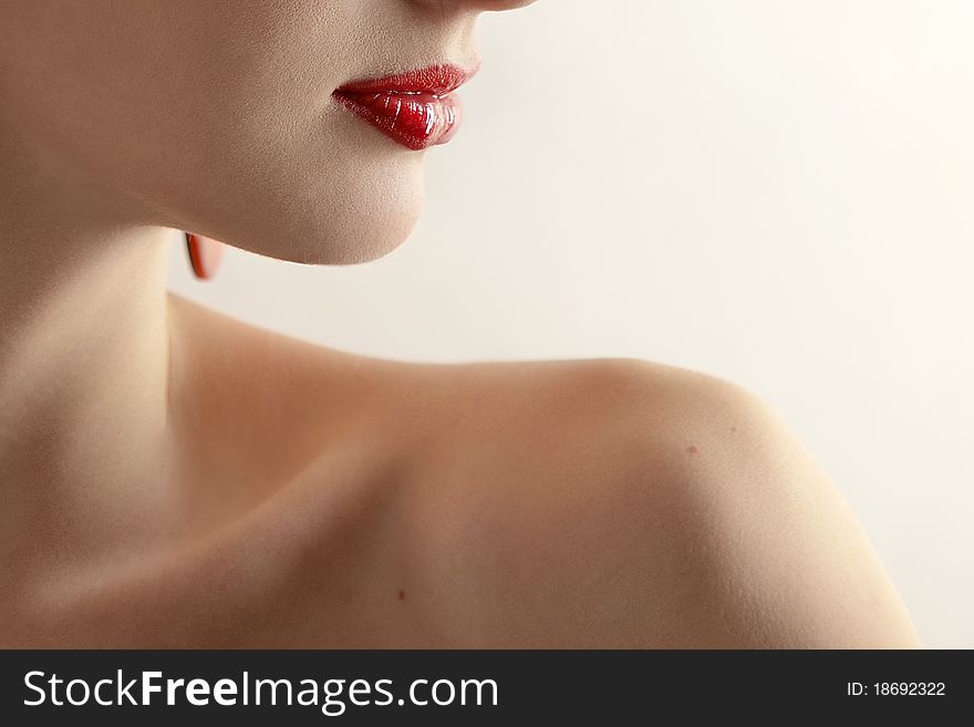 Portrait of a beautiful young woman close-up on a light background. Portrait of a beautiful young woman close-up on a light background