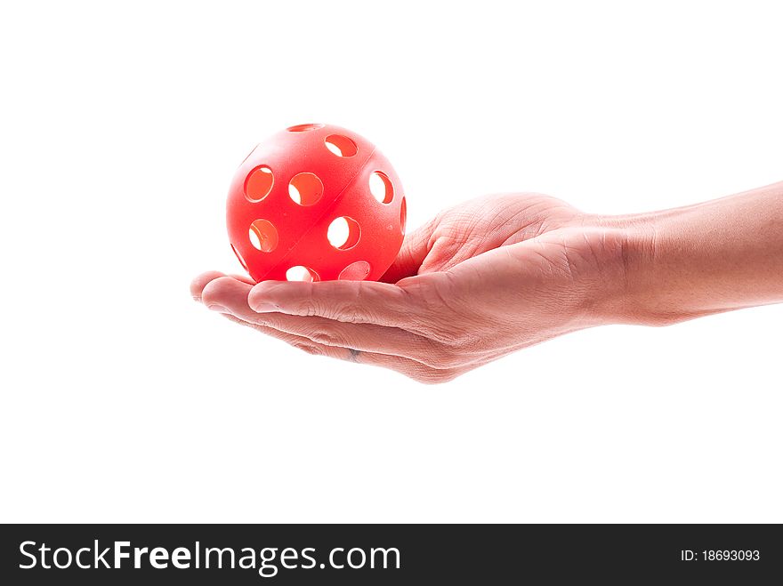 Hand Holding a Red Whistle Ball