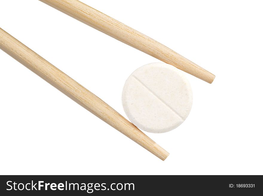 Chopsticks keep a pill. isolated on a white background.