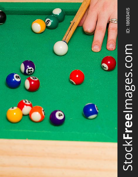 Green billiard (poool) table with bunch of balls