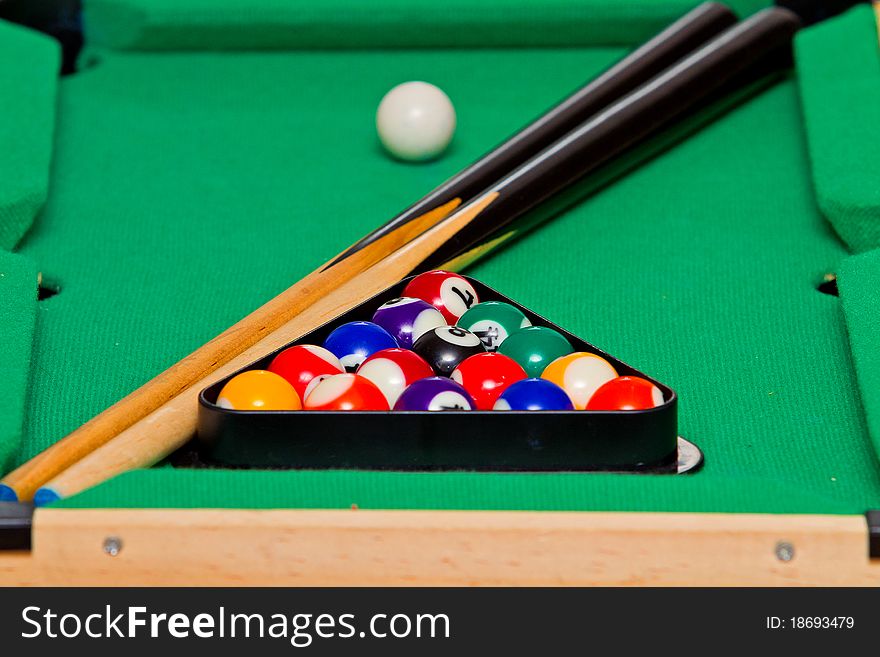 Small green billiard (pool) table