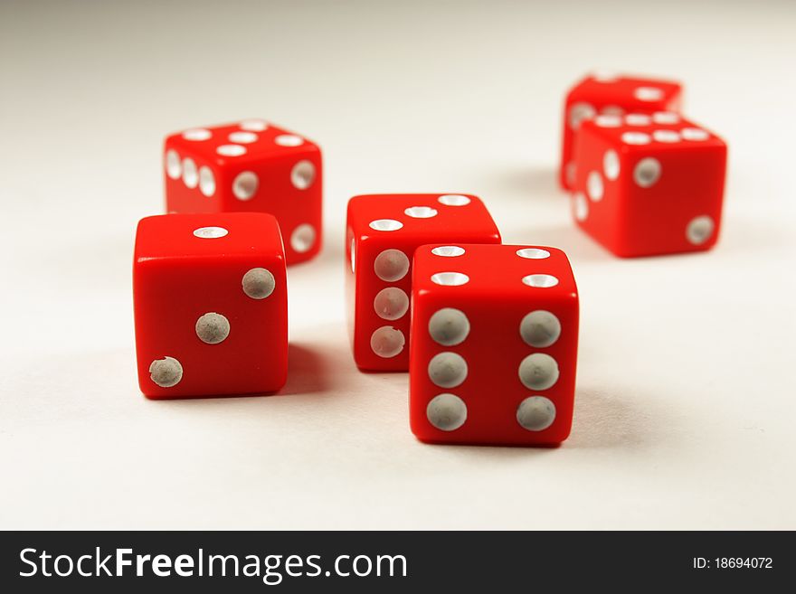 Six red dice with white dots used in a game. Six red dice with white dots used in a game