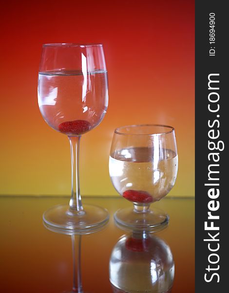 Glass and whisky on a red background. Glass and whisky on a red background