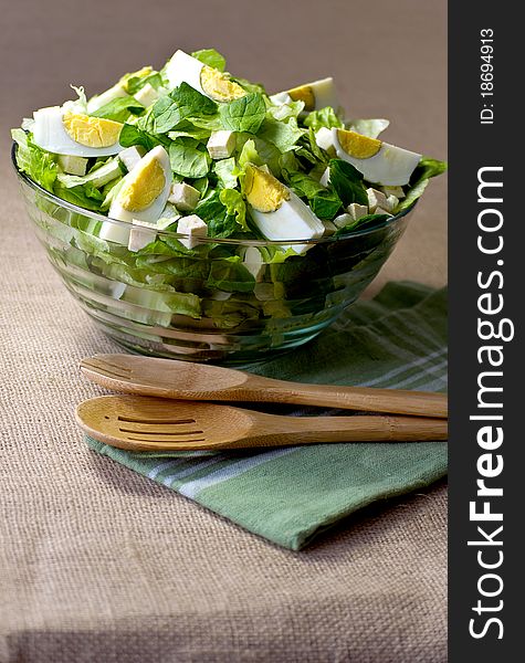 Romain Lettuce, Spinach, Tofu and Eggs in a Glass Bowl. Romain Lettuce, Spinach, Tofu and Eggs in a Glass Bowl