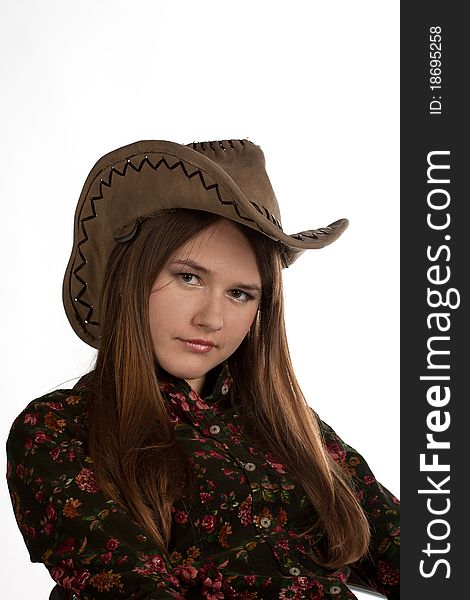 Attractive cowgirl portrait on white background
