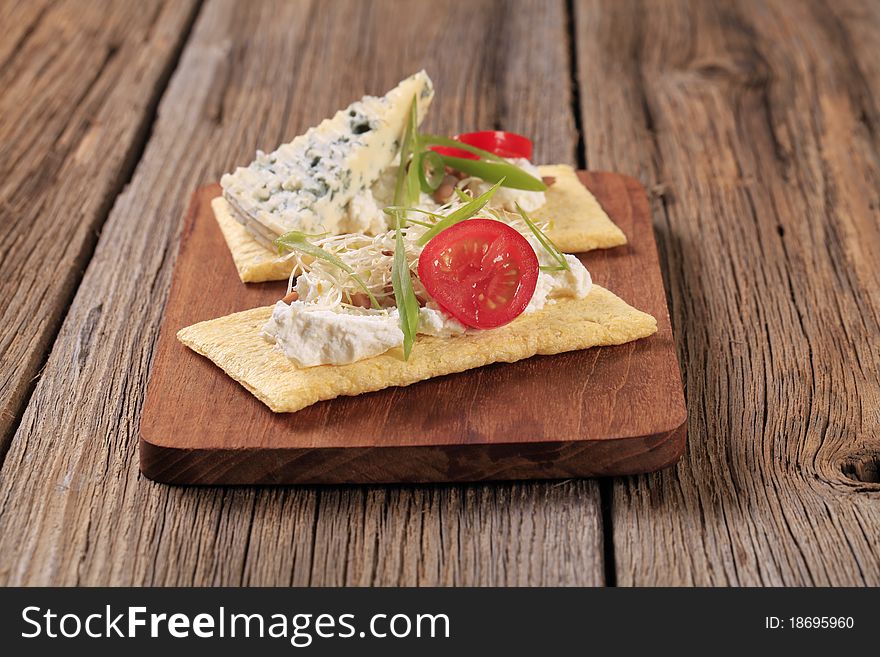 Two slices of corn crispbread and cheese