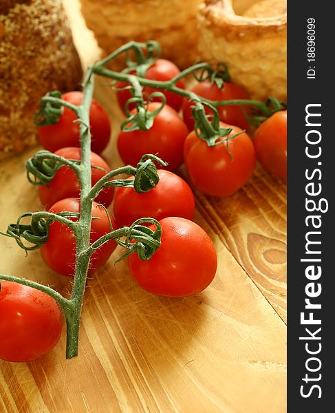 Fresh tomatoes on a wooden background. Fresh tomatoes on a wooden background