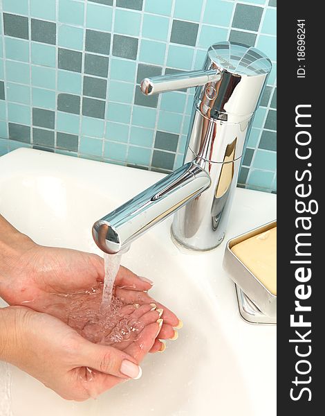 Beautiful girl is washing her hands. Beautiful girl is washing her hands