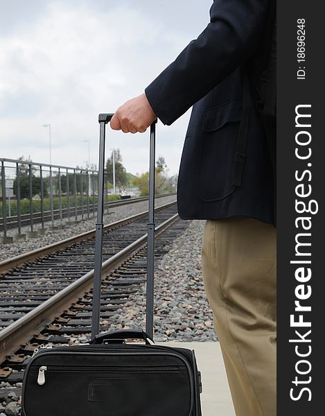 Man on platform waiting for train