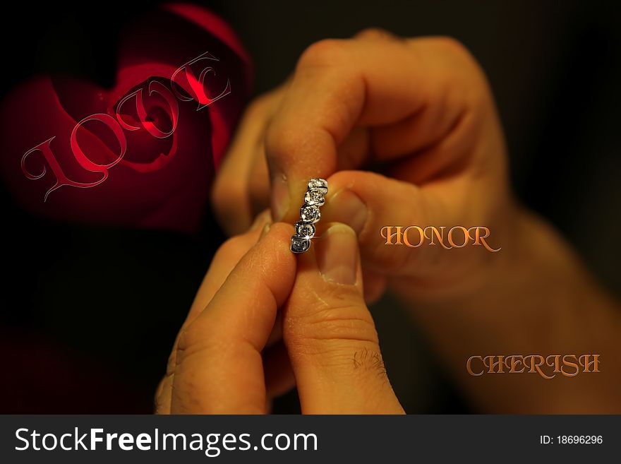 A gentleman holding an engagement ring with a single red rose in the background and the words love cherish and honor. A gentleman holding an engagement ring with a single red rose in the background and the words love cherish and honor.