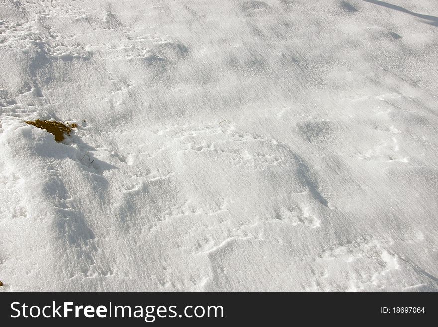 Surface of a snowy field.