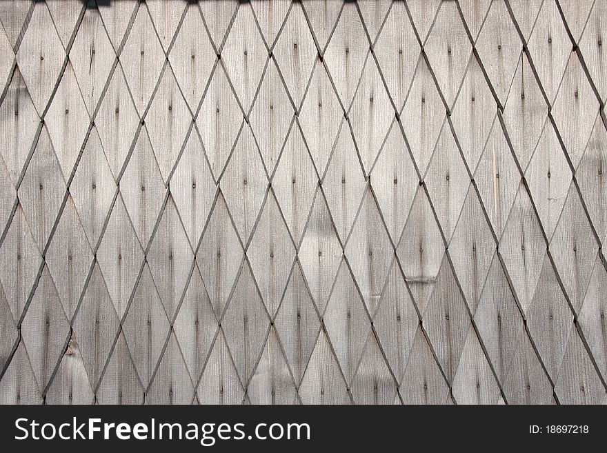 Shingle surface with wooden texture. Part of a wooden house.