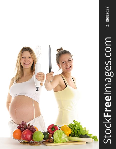 Happy woman with fruit, blender and a knife